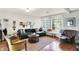 Bright living room with dark green sofa and decor at 710 N Spring St, Greenfield, IN 46140