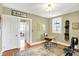 Bright office with hardwood floors, desk, and natural light from the window at 710 N Spring St, Greenfield, IN 46140