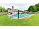 Backyard with in-ground pool, covered for the off-season, and fenced perimeter at 73 Suncrest Dr, Greenwood, IN 46143