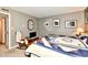 Comfortable bedroom featuring a decorative quilt and calming gray walls at 73 Suncrest Dr, Greenwood, IN 46143