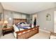 Bedroom with wooden bed frame, quilt, and closet access at 73 Suncrest Dr, Greenwood, IN 46143
