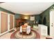 Dining area features a fireplace and a door to the patio at 73 Suncrest Dr, Greenwood, IN 46143
