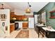 Kitchen features wood cabinets, tile floor, and black appliances at 73 Suncrest Dr, Greenwood, IN 46143
