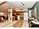 Eat-in kitchen with wood cabinets, tile floors, black appliances and neutral countertops at 73 Suncrest Dr, Greenwood, IN 46143