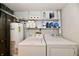 Functional laundry room with modern washer and dryer, and plenty of storage shelves at 73 Suncrest Dr, Greenwood, IN 46143