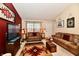 Cozy living room with sofas, a TV, and decorative Southwestern-style rug at 73 Suncrest Dr, Greenwood, IN 46143