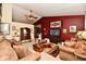 Open-concept living area with a vintage cabinet, multiple sofas, and curated decor at 73 Suncrest Dr, Greenwood, IN 46143
