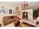 Comfortable living room with sofa, ceiling fan, and curated wall decor at 73 Suncrest Dr, Greenwood, IN 46143
