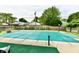 Backyard pool covered with a green tarp and surrounded by a patio at 73 Suncrest Dr, Greenwood, IN 46143