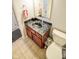 Half bathroom with vanity, sink, and tile flooring at 7322 Stones River Dr, Indianapolis, IN 46259