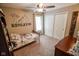 bedroom with a personalized name decal, ceiling fan and natural light at 7322 Stones River Dr, Indianapolis, IN 46259