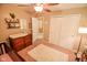 Another view of the Bedroom with a crib, dresser, and carpeted floor at 7322 Stones River Dr, Indianapolis, IN 46259