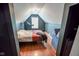 Bedroom featuring a bed and exercise equipment in a room with slanted ceilings at 7322 Stones River Dr, Indianapolis, IN 46259