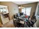 Dining area with table, chairs and adjacent kitchen features an open design at 7322 Stones River Dr, Indianapolis, IN 46259
