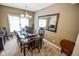 Dining room with a table, chairs, and a large window providing plenty of natural light at 7322 Stones River Dr, Indianapolis, IN 46259