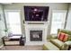 Close up of the fireplace with white mantle and accent decor at 7322 Stones River Dr, Indianapolis, IN 46259