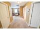 Hallway with carpet and doorways leading to other rooms at 7322 Stones River Dr, Indianapolis, IN 46259