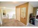 Upstairs hallway featuring neutral carpet, fresh paint, white railing and doors to the bedrooms at 7322 Stones River Dr, Indianapolis, IN 46259