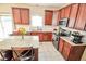 Modern kitchen showcasing stainless appliances, tile backsplash, and a center island at 7322 Stones River Dr, Indianapolis, IN 46259