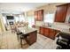 Bright kitchen featuring granite counters, stainless appliances, and ample cabinet space at 7322 Stones River Dr, Indianapolis, IN 46259