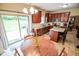 Eat-in kitchen with backyard access features a breakfast nook and bright, open layout at 7322 Stones River Dr, Indianapolis, IN 46259