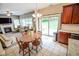 Open-concept kitchen and living area with an easy access to the backyard at 7322 Stones River Dr, Indianapolis, IN 46259