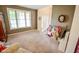 Cozy living room with carpet flooring, and large window with natural light at 7322 Stones River Dr, Indianapolis, IN 46259