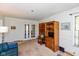 Cozy living room with French doors, built-in shelving, and space for entertaining or relaxing at 7401 Spring Mill Rd, Indianapolis, IN 46260