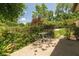 Cozy patio area with outdoor seating surrounded by lush greenery at 7401 Spring Mill Rd, Indianapolis, IN 46260
