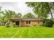 Lush back yard featuring a wooden pergola covered patio at 7580 Sherry Ln, Brownsburg, IN 46112