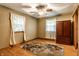 Bedroom features hardwood floors, ceiling fan and two windows at 7580 Sherry Ln, Brownsburg, IN 46112