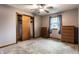 Bedroom with carpet, ceiling fan, closet, and dressers at 7580 Sherry Ln, Brownsburg, IN 46112