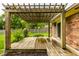 Wooden deck with brick facade and wooden pergola at 7580 Sherry Ln, Brownsburg, IN 46112