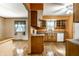A kitchen with custom cabinets, new appliances, and luxury wood floors at 7580 Sherry Ln, Brownsburg, IN 46112