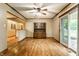 Open floor plan with wood floors, dining area and access to outdoors at 7580 Sherry Ln, Brownsburg, IN 46112