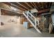 Basement with exposed beams and stairs at 7910 N College Ave, Indianapolis, IN 46240