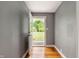 Open entryway featuring hardwood floors and a view of the green front yard at 7910 N College Ave, Indianapolis, IN 46240
