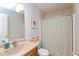 Bathroom with single sink vanity and shower with patterned curtain at 8958 Wooster Ct, Fishers, IN 46038