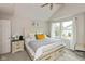 Bright bedroom with large windows, neutral walls and comfortable furnishings at 8958 Wooster Ct, Fishers, IN 46038
