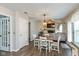 Cozy dining area adjacent to the kitchen, leading to the living room with a fireplace at 8958 Wooster Ct, Fishers, IN 46038
