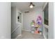 Upstairs hallway with neutral tones and a play area at 8958 Wooster Ct, Fishers, IN 46038