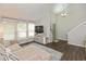 Bright living room with vaulted ceiling, large windows, and a comfortable sectional sofa at 8958 Wooster Ct, Fishers, IN 46038