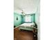 Comfortable bedroom with wood floors, large window and a decorative quilt on the bed at 932 Eagle Brook Cir, Shelbyville, IN 46176