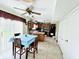 Functional kitchen with an island, tile flooring, and sliding glass door to the backyard at 932 Eagle Brook Cir, Shelbyville, IN 46176