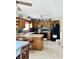 Functional kitchen with tile flooring, updated appliances, and central island at 932 Eagle Brook Cir, Shelbyville, IN 46176