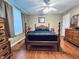 Comfortable bedroom with hardwood floors and a ceiling fan at 932 Eagle Brook Cir, Shelbyville, IN 46176
