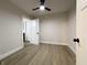 This bedroom features a ceiling fan, natural light, and a neutral color palette at 946 N Somerset Ave, Indianapolis, IN 46222