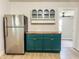 Kitchen with stainless steel refrigerator, butcher block countertops, and modern cabinetry at 946 N Somerset Ave, Indianapolis, IN 46222