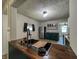 Stylish kitchen featuring stainless steel appliances and custom counter at 946 N Somerset Ave, Indianapolis, IN 46222