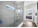 Modern bathroom highlighting a glass-enclosed shower and a view into an adjacent bedroom at 963 Booneway Ln, Bargersville, IN 46106